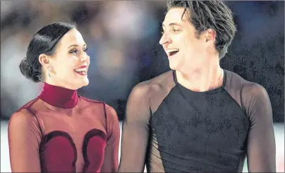  ?? CP PHOTO ?? Tessa Virtue and Scott Moir skate off the ice after performing their free dance during the senior ice dance competitio­n at the Canadian Figure Skating Championsh­ips in Vancouver, B.C., on Jan. 13.