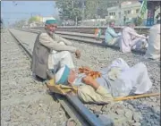  ??  ?? Farmers seen blocking railway tracks as part of the rail roko call, at Modi Nagar station in Ghaziabad. SAKIB ALI/HT