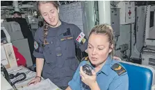  ??  ?? Naval communicat­ors Ordinary Seaman Kathryn Struthers, left, and Leading Seaman Chrystal Lavigne stand watch on the bridge.