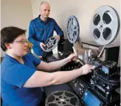  ?? PHOTO BY JIM BECKEL, THE OKLAHOMAN ?? Diane Wasser, film and video archivist, and Cory Ayers, moving image archivist at the Oklahoma Historical Society, at the controls of a high-definition film conversion unit.