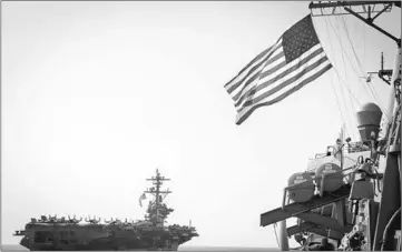  ??  ?? File photo shows the Carl Vinson (left) and the Arleigh Burke-class guided-missile destroyer USS Wayne E Meyer during a surface maneuvers exercise, east of the Korean peninsula, with several other US and Republic of Korea Navy ships and submarines...