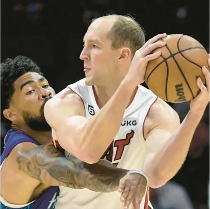  ?? MATT KELLEY/AP ?? Cody Zeller, seen here last weekend against the Hornets, was away from the NBA for more than a year, but as the Heat’s recent addition explained, he hardly was away from competitio­n.