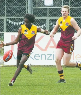  ??  ?? Zac Dawson kicks Drouin into attack as the Under 18 Hawks notched a good win against Sale on Saturday to move up to seventh position on the ladder. Running to give support to Dawson is Ethan Calway.