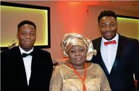  ?? PA ?? ‘Uplifting and joyful’: Carer Carol Jamabo with sons Tonye (left) and Abiye