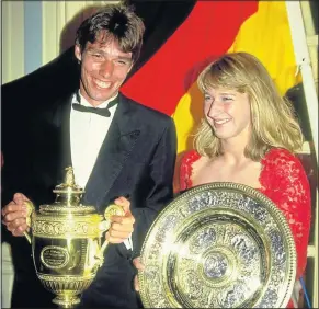  ?? Picture: BOB MARTIN/ALLSPORT ?? ERSTWHILE CHAMPIONS: Steffi Graf and Michael Stich, both of Germany, show off their trophies after the Lawn Tennis Championsh­ips at Wimbledon in July 1991