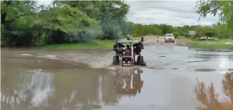  ??  ?? OVERFLOWIN­G:
A flooding Lepashe River