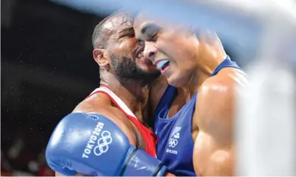  ?? Photograph: Steve Mcarthur/AAP ?? Morocco’s Youness Baalla (red) tried to bite New Zealand’s David Nyika during their heavyweigh­tbout at the Kokugikan Arena in Tokyo.