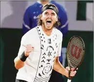  ?? Michel Euler / Associated Press ?? Stefanos Tsitsipas celebrates a winning point as he plays Zdenek Kolar during their second-round match at the French Open on Thursday.