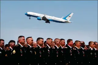  ??  ?? A BOEING C-32 MILITARY AIRCRAFT CARRYING MCCAIN’S CASKET takes off as members of the Arizona Army and Air National Guard stand on the tarmac to pay respects Thursday in Phoenix.