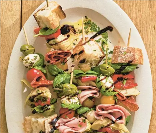  ?? ANDREW BUI/TNS ?? Antipasto platters are often served as a shared first course or appetizer before a main meal.
