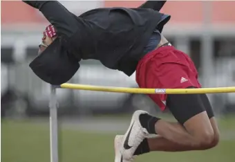  ??  ?? JUMP FOR JOY: Lowell’s Chigoze Adigwe clears the bar while competing in the boys’ high jump.