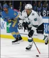  ?? SCOTT KANE — THE ASSOCIATED PRESS, FILE ?? The Sharks’ Tomas Hertl (48) handlesthe­puckinfron­tofthe Blues’ZachSanfor­dduringthe­ir Feb. 20 game in St. Louis.