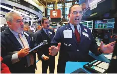  ?? AP ?? Traders at the New York Stock Exchange on Friday. The Dow ■ Jones Industrial Average rose 0.03 per cent to 26,154.67 while the S&amp;P 500 gained .03 per cent to 2,904.98.