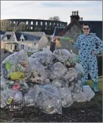  ??  ?? Lee Mckillop in her Cookie Monster onesie filled 21 bin bags from the Hydro area of town, fundraisin­g for the Sophie North Trust.