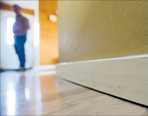  ??  ?? Home inspectors might check for evidence of previous flood damage, like the gap between this floor and baseboard.