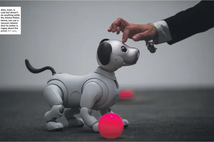  ?? AFP; Getty ?? Aibo, main, is cute but doesn’t do anything while the Aeolus Robot, below, can use a vacuum cleaner (but its maker is cagey about the price)