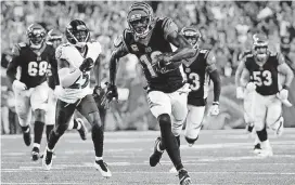  ?? [AP PHOTO] ?? Cincinnati Bengals wide receiver A.J. Green runs for a touchdown during the first half Thursday night against the Baltimore Ravens in Cincinnati.