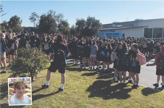  ?? Pictures: CAMPBELL GELLIE ?? Ormeau Woods State High School students and staff gather yesterday for tributes to Lucas Millott (inset) who died at school on Thursday.