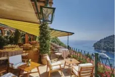  ?? TYSON SADLO/BELMOND SPLENDIDO ?? The restaurant at the Belmond Splendido in Portofino serves up an incredible view and fresh herbs in dishes from on-site gardens.