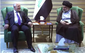  ??  ?? Abadi (left) meets with Sadr in Baghdad. — AFP photo