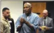  ?? JASON BEAN — THE RENO GAZETTEJOU­RNAL (VIA AP) ?? O.J. Simpson reacts Thursday after learning he was granted parole.