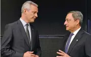  ??  ?? French Finance Minister Bruno Le Maire (left) speaks to Mario Draghi ahead of a Eurogroup meeting in Tallinn, Estonia, on Friday