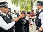  ??  ?? A police officer injured during protests in London last month