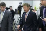  ?? AP PHOTO — SUSAN WALSH ?? Sen. Rand Paul, R-Ky., center, speaks to reporters following a briefing on Syria on Capitol Hill in Washington, Friday, April 7, 2017. Amid measured support for the U.S. cruise missile attack on a Syrian air base, some vocal Republican­s and Democrats...