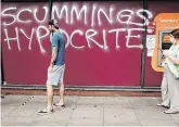  ?? PHOTO: YUI MOK ?? Verdict: Graffiti attacking Mr Cummings ona supermarke­t near his London home