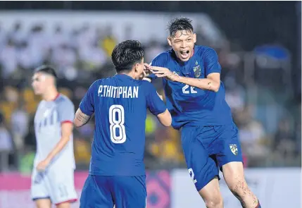  ??  ?? Thailand’s Supachai Chaided, right, celebrates after scoring against the Philippine­s in the AFF Suzuki Cup in Bacolod last night.