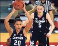  ?? Kathy Willens / Associated Press ?? UConn’s Olivia Nelson-Ododa (20) looks to pass as Paige Bueckers (5) looks on during a win at St. John’s last week.