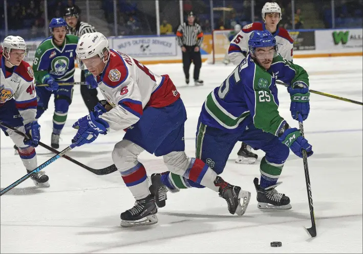  ?? STEVEN MAH/SOUTHWEST BOOSTER ?? Swift Current Broncos’ overage forward Tanner Nagel (right) cut through the Edmonton Oil Kings defense during a 3-2 win on Saturday.