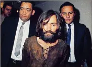  ?? ASSOCIATED PRESS ?? Charles Manson is escorted to his arraignmen­t in 1969 on conspiracy-murder charges in connection with the killings of seven people by the so-called Manson family in Los Angeles.