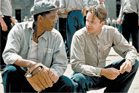  ?? CASTLE ROCK ENTERTAINM­ENT ?? Morgan Freeman, left, and Tim Robbins in 1994’s “The Shawshank Redemption,” which has been the No. 1-rated movie on IMDb for the past 11 years.