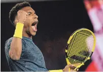  ?? ANDY BROWNBILL THE ASSOCIATED PRESS ?? Canada’s Felix Auger-Aliassime celebrates after defeating compatriot Denis Shapovalov in their third-round match,
7-5, 7-5, 6-3, at the Australian Open in Melbourne on Friday.