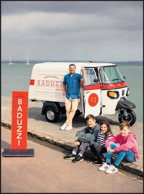 ?? Photo / Babiche Martens ?? Baduzzi’s Michael Dearth rolls out a meatball truck with ‘little helpers’ Ezra Phoenix Dearth, Lucia Rose Dearth and George Lowe.