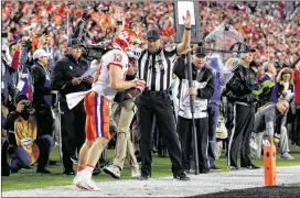  ?? TOM PENNINGTON / GETTY IMAGES ?? Clemson’s Hunter Renfrow celebrates after making a 2-yard touchdown reception against Alabama to clinch the national championsh­ip.