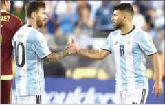  ?? NELSON ALMEIDA/AFP ?? Lionel Messi (left) shakes Sergio Aguero’s hand after Argentina’s Copa America quarterfin­al against Venezuela on June 18.