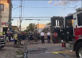  ?? (AP/Philadelph­ia Fire Department) ?? Emergency personnel respond to the scene of a building that caught fire, then collapsed early Saturday in Philadelph­ia.