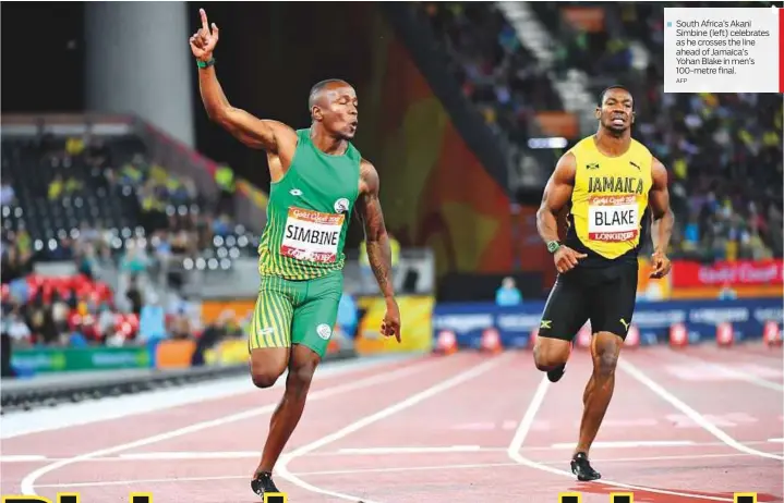  ?? AFP ?? South Africa’s Akani Simbine (left) celebrates as he crosses the line ahead of Jamaica’s Yohan Blake in men’s 100-metre final.