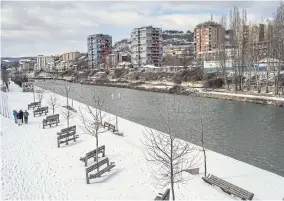  ??  ?? The Ibar River in Mitrovica, Kosovo, which separates Kosovo Albanians living on the south side of the city, left, from the country’s Serbians living on the north side, in Kosovo.