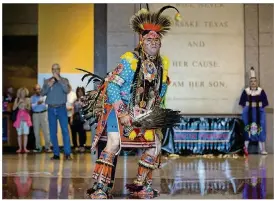  ?? QILING WANG / AMERICAN-STATESMAN ?? Brody Screaming Eagle performs a dance during the American Indian Heritage Day at the Bullock Texas State History Museum last year.