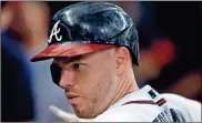  ?? Todd kirkland/Getty Images north america/Tns ?? Freddie Freeman of the Atlanta Braves reacts after his solo home run in the sixth inning against the San Diego Padres at Truist Park in Atlanta on Tuesday, July 20, 2021.