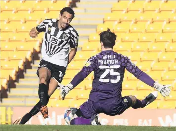  ??  ?? NO WAY THROUGH: Kurtis Guthrie is denied by Cambridge keeper Callum Burton.