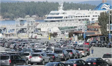  ??  ?? The B.C. Ferries terminal at Swartz Bay has been a busy place with record numbers of vehicles and passengers.