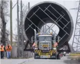  ?? GARY YOKOYAMA/THE HAMILTON SPECTATOR ?? Alectra Utilities crews were at strategic points along the route to move overhead wires to clear a safe path for the 100,000-pound exhaust stack.