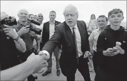  ?? [FRANK AUGSTEIN/THE ASSOCIATED PRESS] ?? Conservati­ve Party leadership candidate Boris Johnson shakes hands with fans in Barry Island, Wales, on Saturday. Johnson angered some Brits when he said that learning to speak English should be a priority for immigrants.