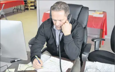  ?? DAVE STEWART/THE GUARDIAN ?? District 11 Liberal candidate Bob Doiron works the phones Wednesday at his campaign headquarte­rs ahead of Monday’s byelection. Doiron is locked in a legal battle with the Workers Compensati­on Board after his benefits were cut off following an...