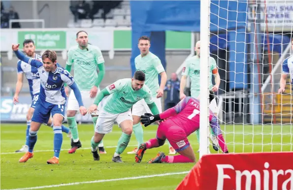  ??  ?? Sam Nicholson, second left, scores Bristol Rovers’ sixth goal during yesterday’s FA Cup second-round match against Darlington at the Memorial Stadium