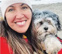  ?? THE CANADIAN PRESS ?? Angela Gevaudan, whose husband was killed in the Moncton shootings in 2014, with her emotional support animal Quinton.